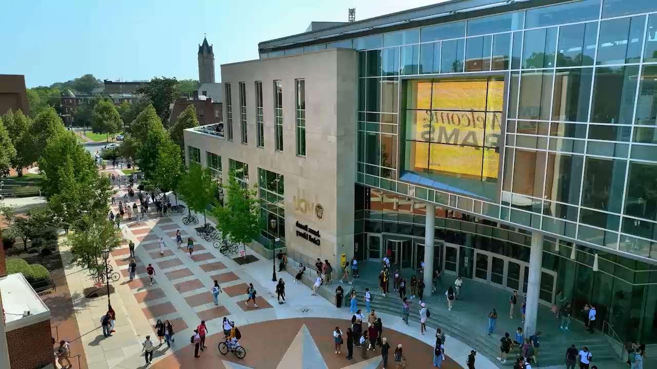 View of the library with students walking around the Compass